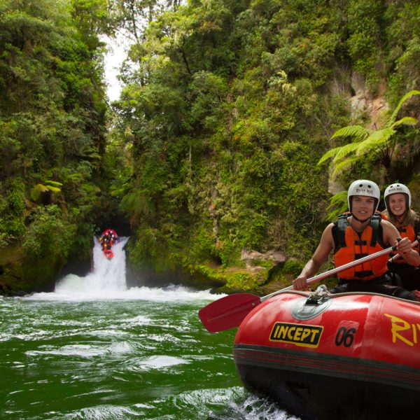 people in a river raft