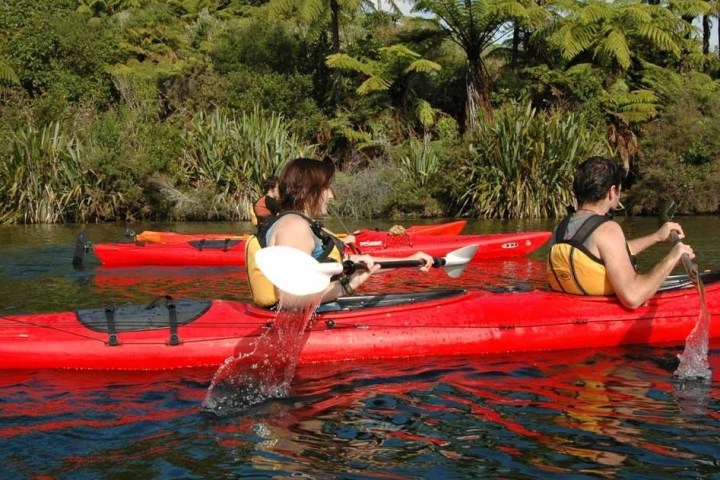 a person sitting on a raft in a body of water