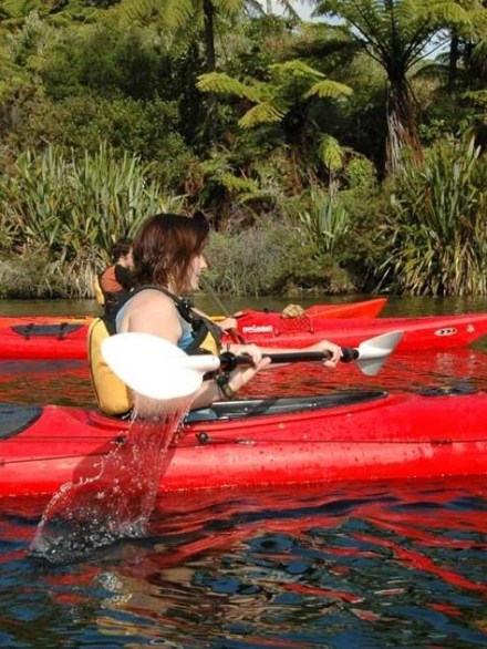 a person sitting on a raft in a body of water