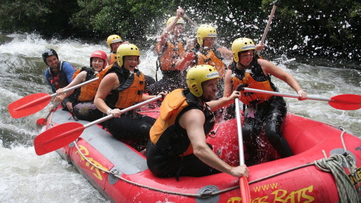 a group of people on a raft in the water