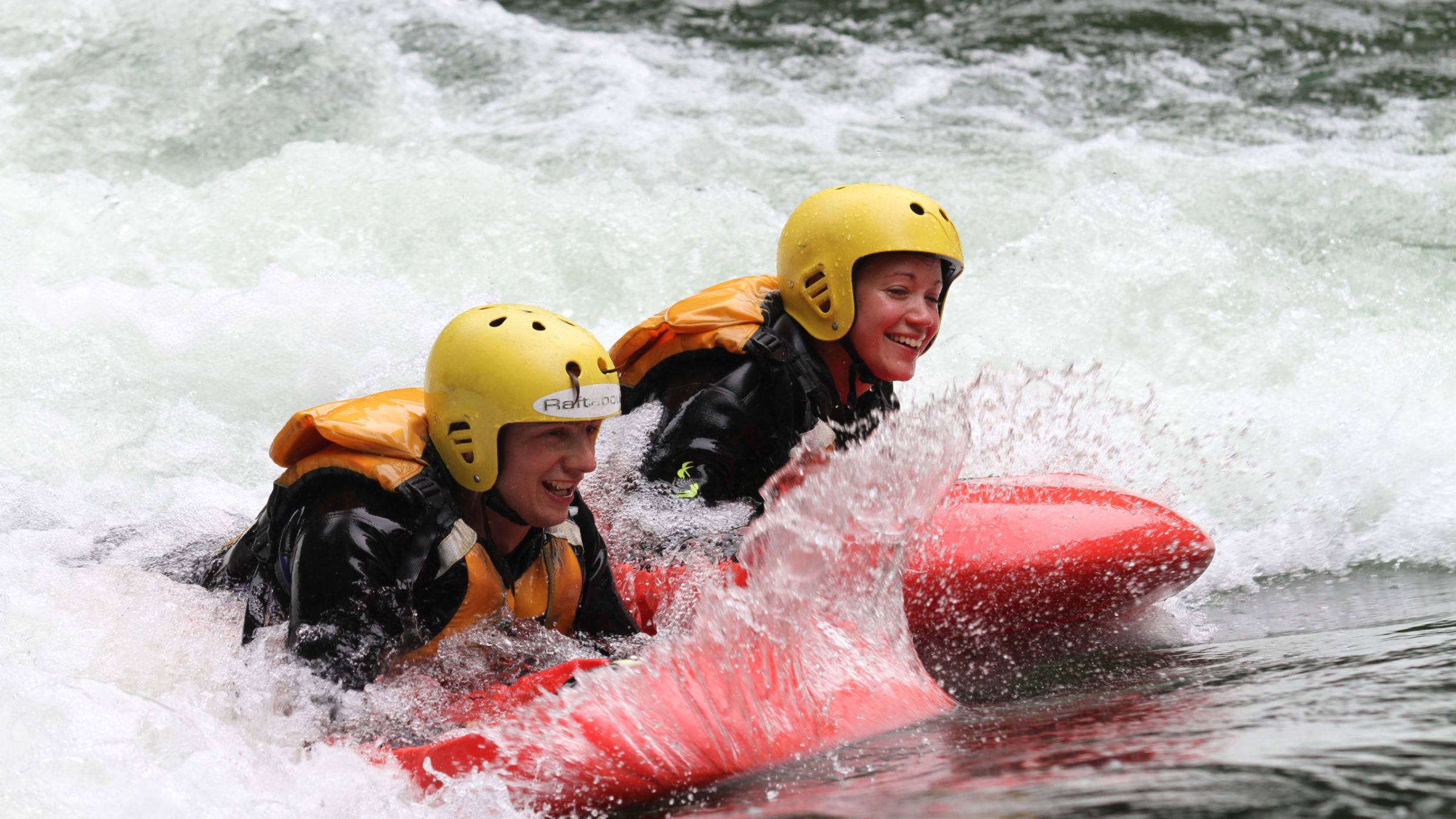 a man riding a wave on a surf board on a body of water
